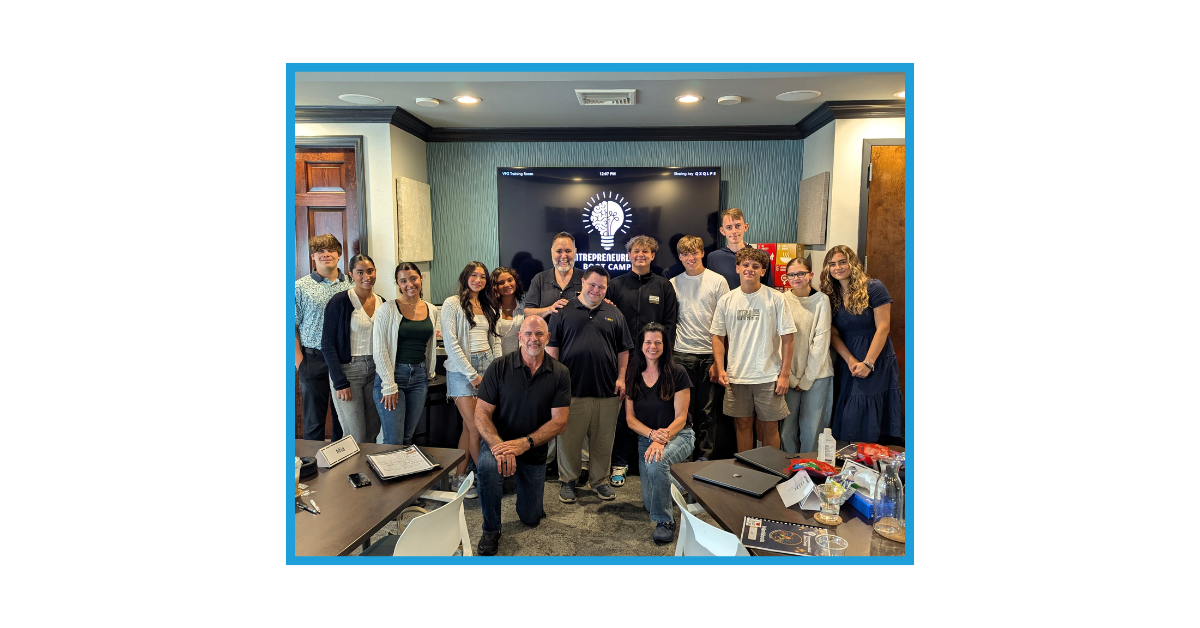 John and Mark join the bootcamp participants for a group photo.