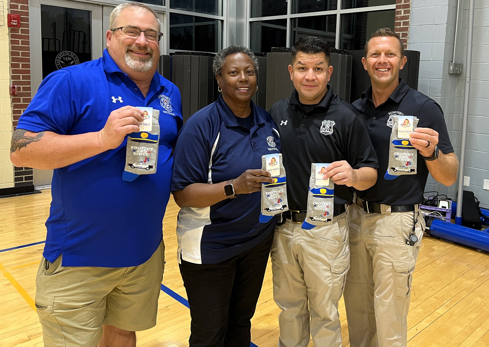 John and Mark Present Police Tribute Socks to the Nassau County Police Activity League (PAL)