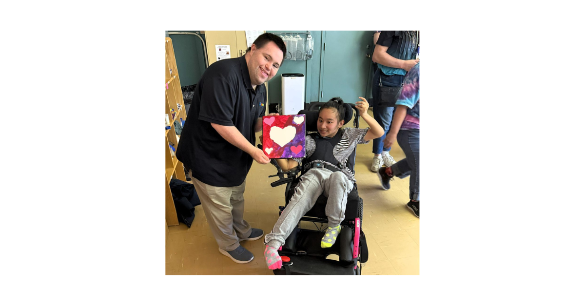 John proudly holding a beautiful painting gifted by Ser Nay Paw, an inspiring young artist.