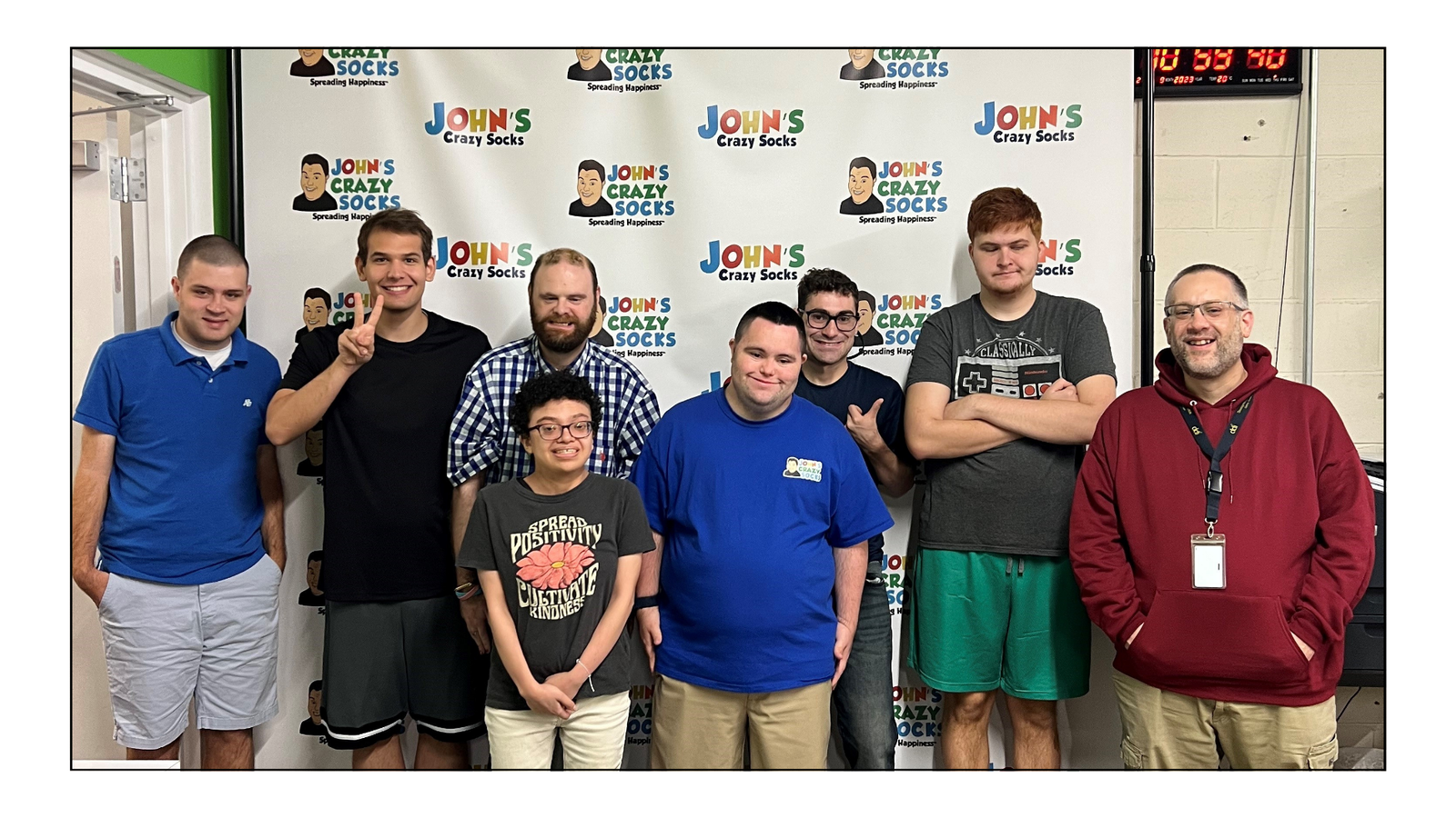 John Cronin, co-founder and Chief Happiness Officer of John’s Crazy Socks, welcoming a tour group.