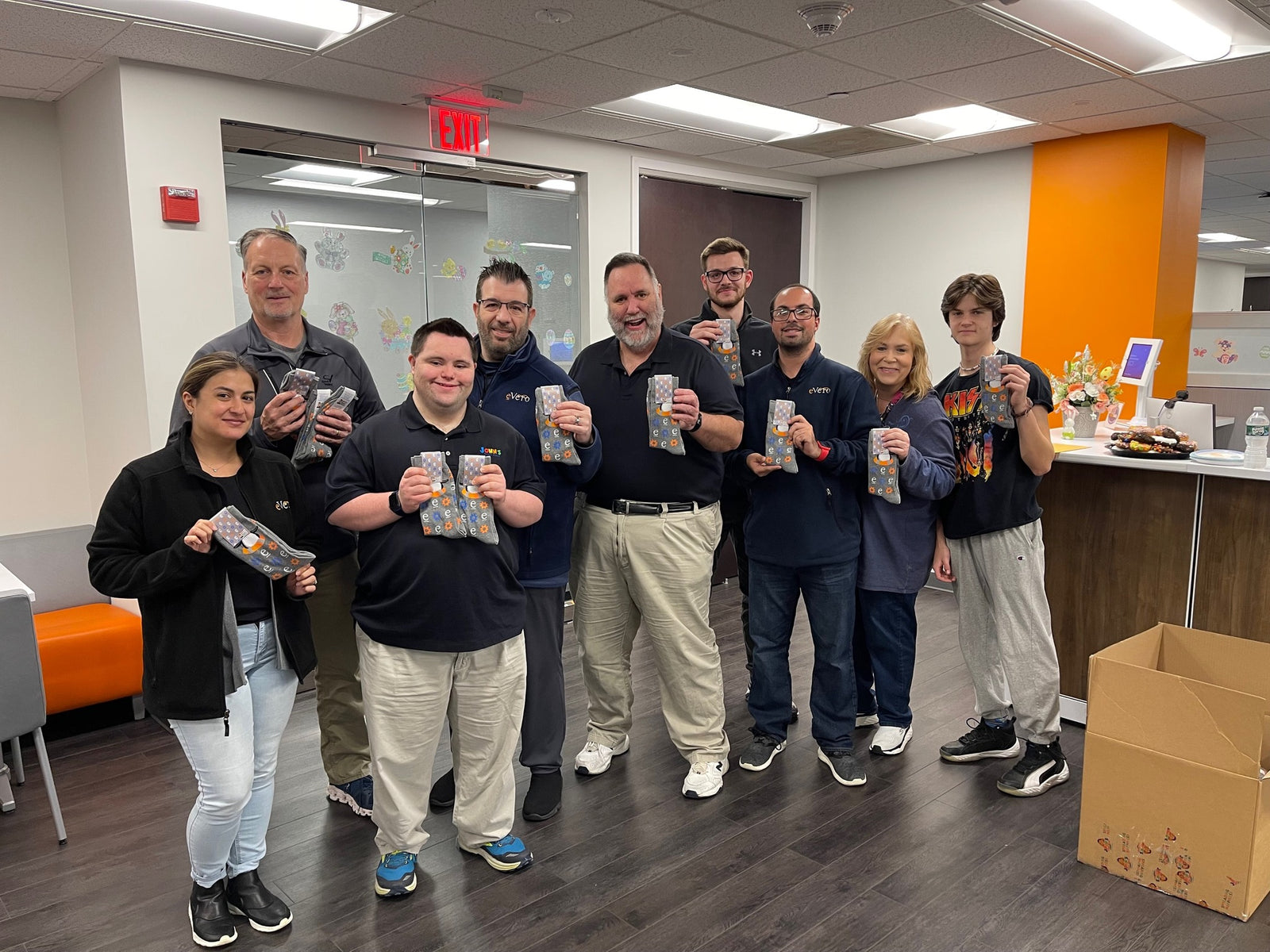 John Makes a Personal Delivery of Custom Socks to the eVero Corporation