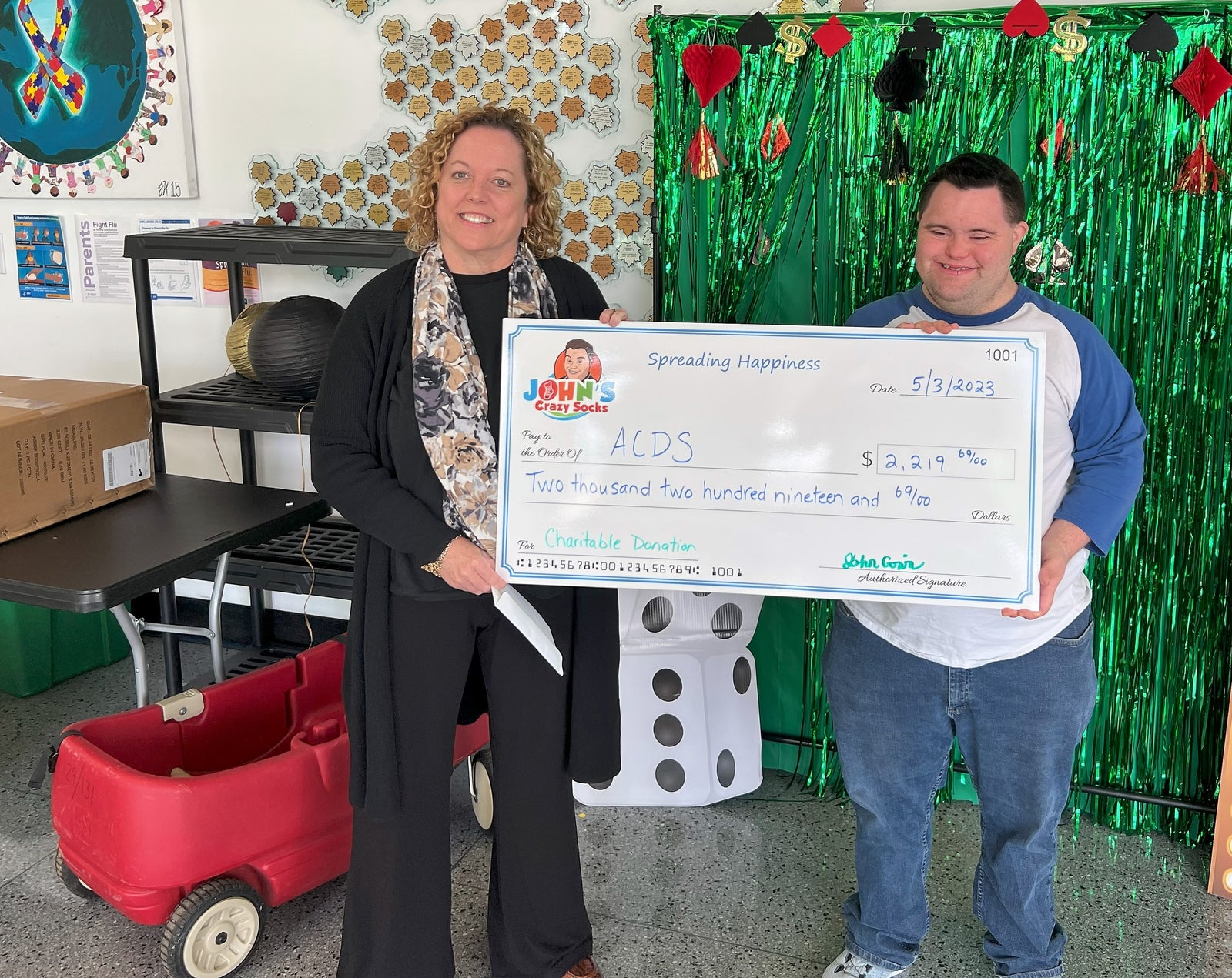 John’s Crazy Socks Delivers a Donation to ACDS