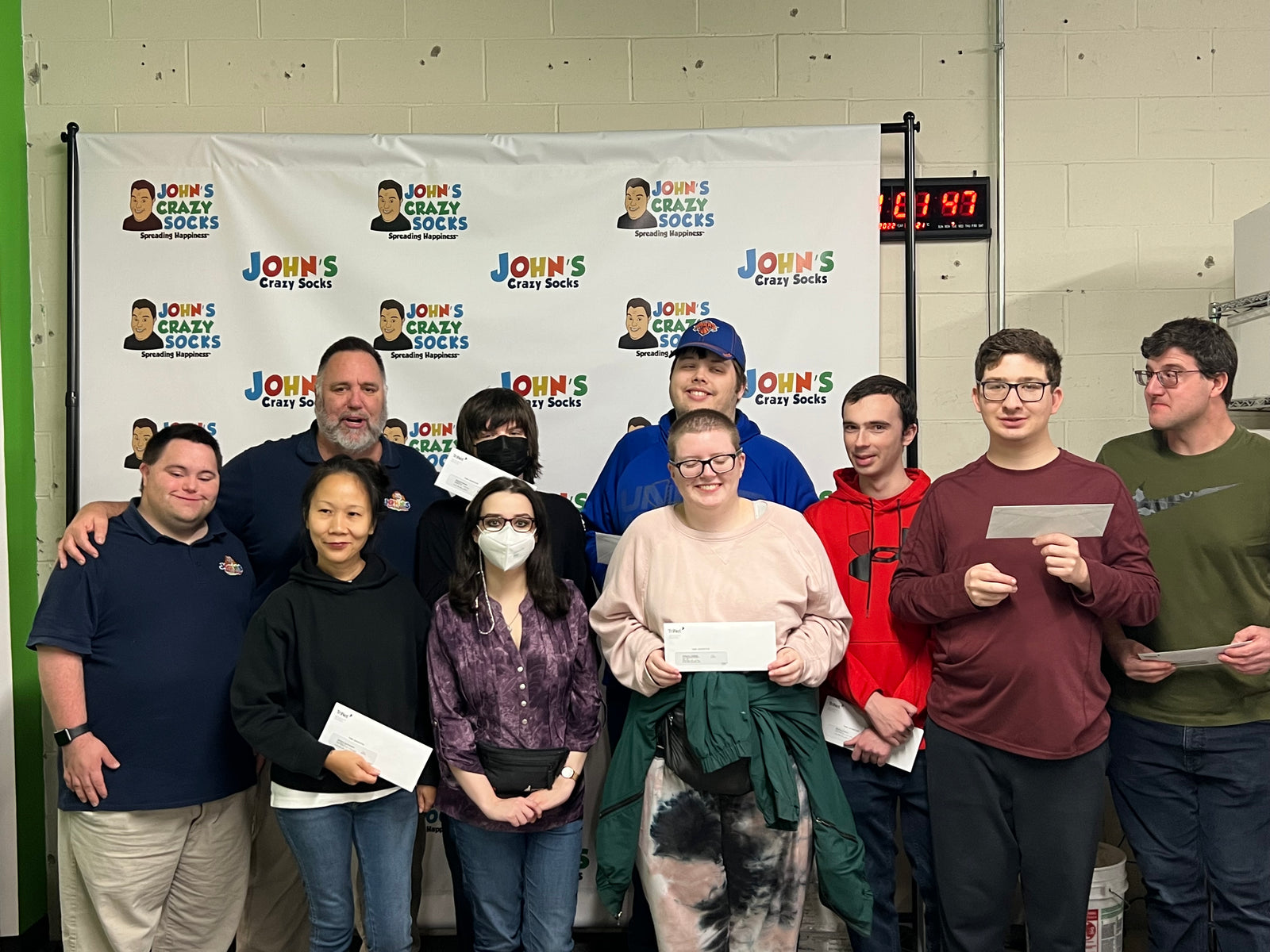 First Check Presentation: Celebrating Colleagues Receiving their First Paychecks