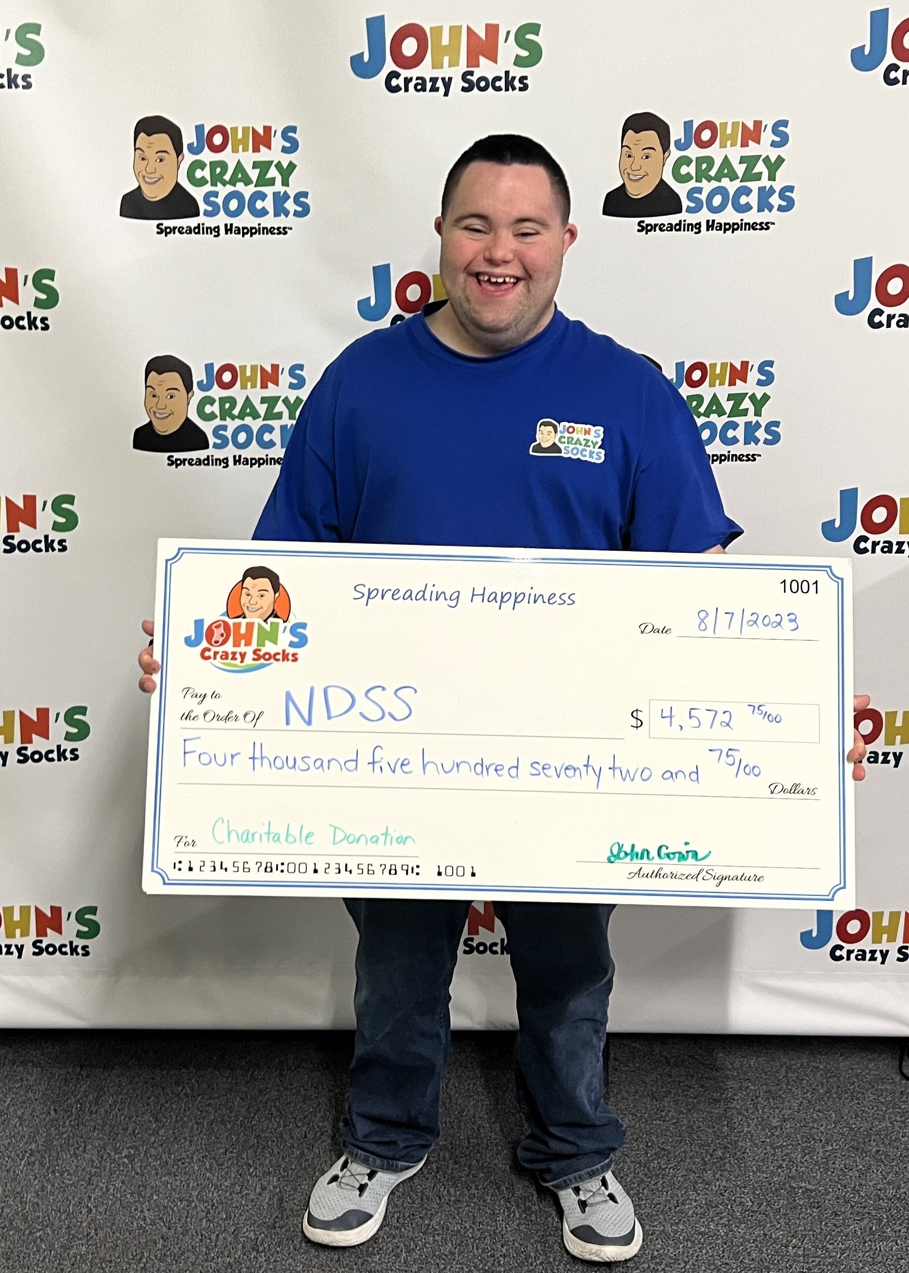 John’s Crazy Socks Sends a Big Check to the National Down Syndrome Society (NDSS)
