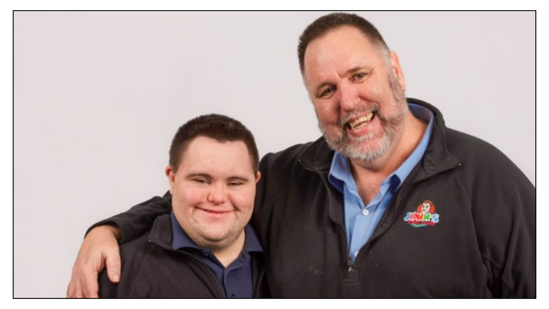 An image of a smiling John and Mark, the co-founders of John's Crazy Socks.