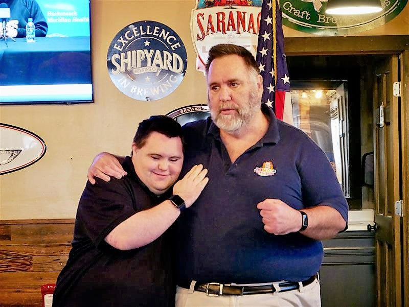 John and Mark X. Cronin of John’s Crazy Socks Speak with the Patchogue Rotary