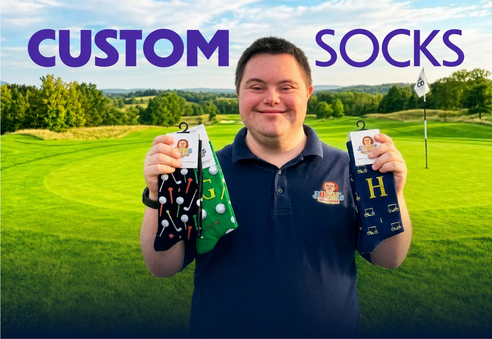 John Cronin holding custom golf socks on a golf course — Custom Socks by John's Crazy Socks